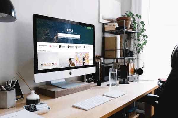 Types of Membership Sites - done for you resources - AccessAlly iMac on desk with example mockup of Membership site type: done for you resources.