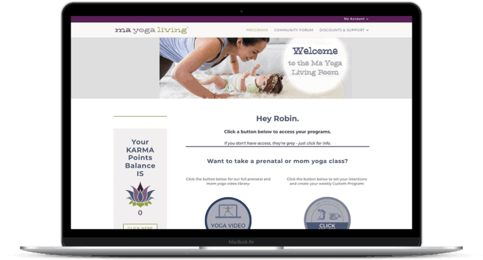 Laptop with mockup of membership sites for moms: ma yoga living dashboard