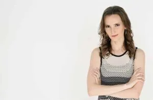 Nathalie Lussier posing with arms crossed