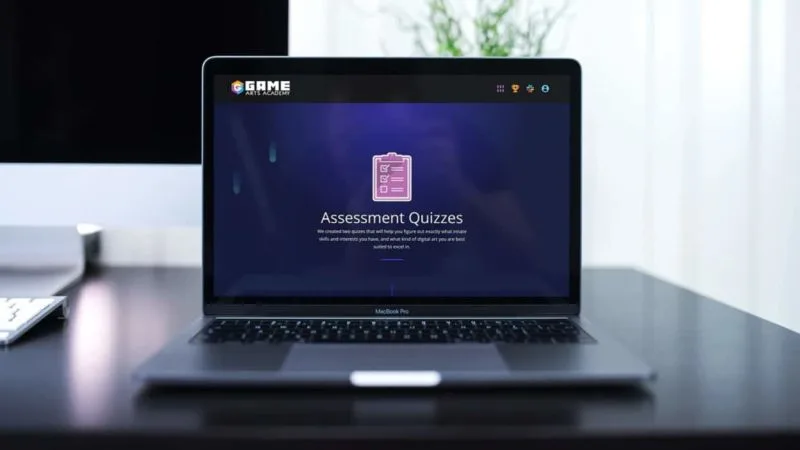Online Course Format for Gaming Arts - AccessAlly Laptop computer with a screenshot of an assessment quiz