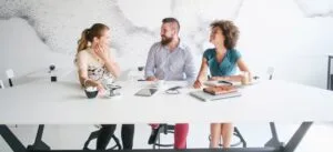 Header-group3 - AccessAlly Three people at a desk with computers