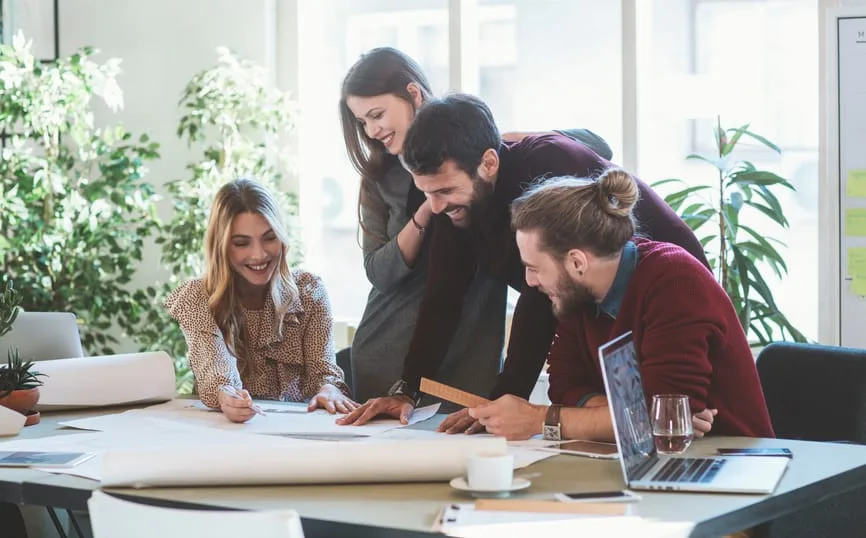 Four people collaborating on a project