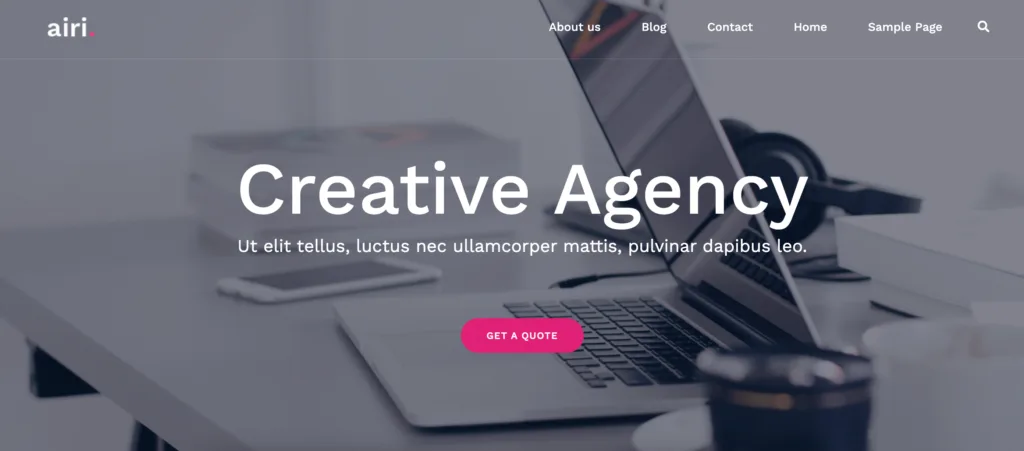 Airi theme demo site. Greyed out background, white text and a pink button